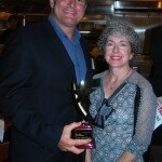 Tom DiGiorgio receives a Shining Star award from Melissa Rapkin, chair of the Pompano Beach Chamber. Rapkin presented all the awards.